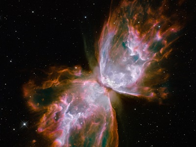 Link zur Beschreibung der Veranstaltung "Magische Reise in kosmische Welten". Das Bild zeigt den Schmetterlingsnebel. 